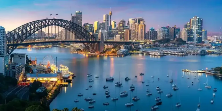A stunning sunset view of the Sydney Harbour Bridge and city skyline, representing Kloudac’s international reach. As a premier accounting firm in Dubai, we provide world-class accounting services to businesses and partners across Australia.
