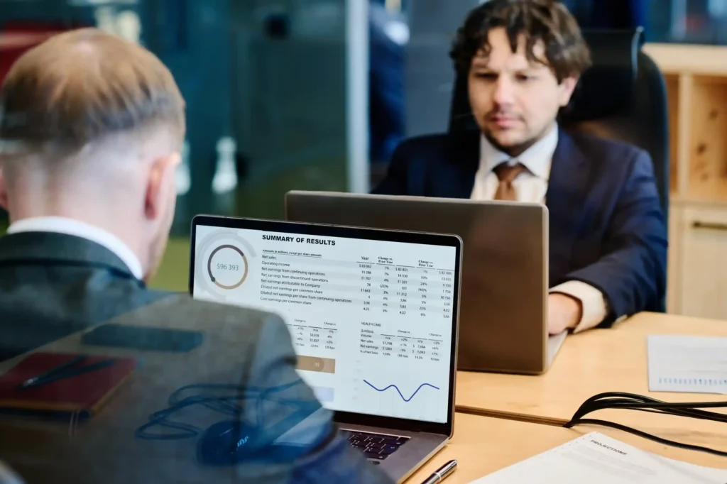 A Kloudac auditor presenting a detailed financial report and compliance data; Kloudac is a trusted accounting firm in Dubai providing external audit, risk assessment, and accounting services.